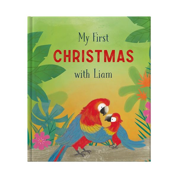 My First Christmas With . . . hardback book on a  rug on a wooden background